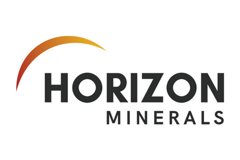 Investor Insight                                
Horizon Minerals’ near-term cash-flow potential, large-scale gold resource base, and strategic processing infrastructure in the prolific Western Australian Goldfields position the company to transition into a sustainable, standalone mid-tier gold producer. Recent acquisitions, operational start-ups and high-grade resource expansions strengthen Horizon’s ability to leverage record gold prices and deliver consistent shareholder returns.
                            Overview                                
Horizon Minerals (ASX:HRZ,OTC:HRZMF) is an emerging standalone gold producer strategically positioned in the heart of Western Australia’s world-class goldfields. The company has built a robust portfolio of high-quality gold projects complemented by significant base and precious metal resources, all within easy haulage distance of key processing infrastructure. 
<em><em>Horizon currently holds 1.8 Moz of resources across 1,386 sq km of exploration tenure.</em></em>
Following the transformational merger with Poseidon Nickel in early 2025 and the acquisition of the Gordons project in August 2025, Horizon now controls a total mineral resource of 1.82 million ounces (Moz) of gold at an average grade of 1.84 grams per ton (g/t), along with substantial silver, zinc, nickel, cobalt and manganese resources.
Central to Horizon’s growth strategy is the 2.2 Mtpa Black Swan processing facility, acquired through the Poseidon transaction. Located just 40 km north of Kalgoorlie, the plant is currently on care and maintenance but is fully permitted and connected to power and water. A low-capex refurbishment and conversion to a gold CIL circuit is underway, forming the backbone of Horizon’s plan to establish a sustainable ~100,000 ounce per annum production profile from late 2026.
<em><em>The Black Swan processing facility is at the heart of Horizon’s stand-alone gold production strategy.</em></em>
In parallel, Horizon is generating strong near-term cash flow from ore sales and toll milling arrangements at its Boorara and Phillips Find operations, respectively, both of which have delivered first gold in 2025. These operations, together with high-grade satellite deposits such as Burbanks, Penny’s Find, Cannon and the newly acquired Gordons Dam, will provide the feedstock for Black Swan’s initial five-year mine plan.
The company’s consolidated 1,386 sq km landholding spans some of the most prospective geological trends in the Goldfields, offering a mix of advanced development assets, near-mill open pits, and highly prospective exploration ground. With approximately 50,000 metres of drilling budgeted for FY25–26, Horizon is targeting both resource growth and upgrades in confidence across its portfolio. 
Leveraging record gold prices and a strong balance sheet, Horizon is now at an inflection point – transitioning from a developer with multiple growth options into a fully integrated, cash-generating, standalone Western Australian gold producer.
                            Company Highlights                                
Emerging standalone gold producer with an extensive WA Goldfields portfolio and a total mineral resource of 1.82 million ounces gold plus significant silver, zinc, nickel, cobalt and manganese resources.
Acquisition of Poseidon Nickel delivers the 2.2 million tonnes per annum (Mtpa) Black Swan processing facility, strategically located 40 km north of Kalgoorlie, with refurbishment studies underway for conversion to a gold carbon-in-leach (CIL) plant.
Acquisition of the Gordons project from Yandal Resources adds 77 sq km of tenure near Black Swan, including the Gordons Dam deposit (365 kt @ 1.7 grams per ton gold for 20 koz) with strong exploration upside.
Continuous cash flow generation from two producing mines, via the ore sale agreement for Boorara (~AU$30 million estimated free cashflow at AU$3,600/oz) and the joint venture toll milling agreement at Phillips Find.
Record gold prices (>AU$5,000/oz) underpin robust margins and fund ~50,000 metres of drilling in FY25–26, targeting both resource growth and confidence upgrades.
Combined landholding of 1,386 sq km in Western Australia’s most productive gold belts, following the Poseidon and Gordons acquisitions
                            Key Projects                                
Boorara Gold Project
The Boorara gold project, located just 15 kilometres east of Kalgoorlie-Boulder, is Horizon’s cornerstone operation and the foundation of its near-term cashflow strategy. Over the past decade, extensive reverse circulation and diamond drilling has defined a substantial JORC 2012 mineral resource of 10.53 Mt grading 1.27 g/t gold for 428,000 ounces. Boorara is strategically positioned within trucking distance of multiple third-party processing facilities and only two kilometres from Horizon’s 100-percent-owned Nimbus silver-zinc project.
<em><em>Mine operations at the Boorara gold project</em></em>
Open pit mining commenced in August 2024, marking the start of Horizon’s transition to gold production. First ore was exposed and mined in late September 2024, with the inaugural gold pour achieved in January 2025. Mining operations are planned over approximately 14 months, with processing to occur over 19 months. A binding ore sale agreement with Paddington Gold provides for the processing of 1.24 Mt of Boorara ore at their Paddington mill until Q2 2026. The agreement is forecast to deliver more than AU$30 million in free cash flow at a gold price of AU$3,600/oz, with upside potential given current spot prices exceeding AU$5,000/oz.
Importantly, Boorara is not just a standalone deposit; it is the central baseload feed source in Horizon’s integrated production plan. It will be supplemented by higher-grade satellite ore from projects such as Burbanks, Penny’s Find, Cannon, Phillips Find and Gordons Dam. This blend of tonnage and grade is designed to optimise mill feed once Black Swan is recommissioned, extending the life of mine and improving overall project economics..
Phillips Find Gold Project
The Phillips Find gold project, 45 kilometres northwest of Coolgardie, is a high-grade goldfield with a production history of about 33,000 ounces. Horizon is advancing the project under a low-risk joint venture with BML Ventures, which funds and manages all mining and operational activities.
First ore was mined in late 2024, with the initial gold pour in February 2025 from toll treatment at FMR Investments’ Greenfields mill. Early campaigns processed 56,300 dry tonnes at 1.63 g/t gold for 2,807 ounces, sold at an average AU$4,894/oz, generating approximately AU$13.7 million in gross revenue to the JV.
Milling agreements include capacity at the Greenfields mill from February to June 2025 and a September-October 2025 campaign for 70,000 tonnes at Focus Minerals’ Three Mile Hill plant. An additional 80,000 tonnes of capacity has been reserved at Greenfields for future ore, giving Horizon strong processing flexibility while complementing production from Boorara and other satellite deposits.
Burbanks Gold Project
Horizon’s high-grade growth asset, the Burbanks gold project, lies nine kilometres southeast of Coolgardie on the prolific Burbanks Shear Zone. With historical production exceeding 420,000 ounces, Burbanks now hosts 465,000 ounces at 2.80 g/t gold across open pit and underground resources. The deposit remains open in all directions, and recent drilling has demonstrated strong potential for significant extensions, with a major 30,000 metre drill campaign underway to support the Black Swan five-year mine plan.
Gordons Project
In August 2025, Horizon expanded its near-mill project pipeline with the acquisition of the Gordons project from Yandal Resources. This 77 sq km package, only 10 kilometres from the Black Swan facility, includes the Gordons Dam deposit with 20,000 ounces in resource and multiple drill-ready prospects, such as Star of Gordon and Malone. The strategic location and exploration upside of Gordons make it an ideal fit for Horizon’s centralised processing strategy.
Black Swan Processing Facility
<em><em>Existing flotation circuit and planned changes to facilitate gold production at Black Swan</em></em>
At the heart of Horizon’s stand-along gold production strategy is the Black Swan processing facility, secured through a February 2025 merger with Poseidon Nickel. This 2.2 Mtpa concentrator, currently on care and maintenance, is being refurbished and converted to include a gold CIL circuit. All necessary approvals are in place, and engineering studies led by GR Engineering are progressing towards first gold production from Black Swan in late 2026. The plant’s location and capacity offer Horizon the ability to unlock value from its own resources and potentially treat stranded third-party ores.
Other Projects
<strong>Cannon Underground Project</strong>
Fully permitted high-grade underground project 30km ESE of Kalgoorlie
Pre-feasibility study complete
<strong>Penny’s Find</strong>
High-grade UG project with MRE of 0.43Mt @ 4.57g/t Au for 63koz
Pre-feasibility completed December 2024
<strong>Nimbus Silver-Zinc Project</strong>
12.1 Mt @ 52 g/t silver, 0.2 g/t gold, 0.9 percent zinc for 20.2 Moz silver, 77 koz gold, 104 kt zinc
High-grade core: 0.26 Mt @ 774 g/t silver, 12.8 percent zinc
Concept study supports concentrate production pathway
                            Management Team                                
Ashok Parekh – Non-executive Chairman
Ashok Parekh has over 33 years of experience advising mining companies and service providers in the mining industry. He has spent many years negotiating mining deals with publicly listed companies and prospectors, leading to new IPOs and the initiation of new gold mining operations. Additionally, he has been involved in managing gold mining and milling companies in the Kalgoorlie region, where he has served as managing director for some of these firms. Parekh is well-known in the West Australian mining industry and has a highly successful background in owning numerous businesses in the Goldfields. He was the executive chairman of ASX-listed A1 Consolidated Gold (ASX:AYC) from 2011 to 2014. He is a chartered accountant.
Warren Hallam – Non-executive Director
Warren Hallam is currently a non-executive director of St Barbara Limited and Poseidon Nickel Limited, and non-executive chairman of Kingfisher Mining Limited. Hallam has built a strong track record over 35 years in operations, corporate and senior leadership roles across multiple commodities. This includes previous Managing Director roles at Metals X Limited, Millenium Metals and Capricorn Metals. Hallam is a metallurgist with a Master in Mineral Economics from Curtin University.
Grant Haywood – Managing Director and Chief Executive Officer
Grant Haywood brings over three decades of experience in both underground and open-cut mining operations. During his career, he has served in senior leadership capacities in various mining companies, guiding them from feasibility through to development and operations. His experience spans various roles within junior and multinational gold mining companies, predominantly in the Western Australian goldfields, including positions at Phoenix Gold, Saracen Mineral Holdings, and Gold Fields. He is a graduate of the Western Australian School of Mines (WASM) and has also earned a Masters in Mineral Economics from the same institution.
Julian Tambyrajah – Chief Financial Officer & Company Secretary
Julian Tambyrajah is an accomplished global mining finance executive with more than 25 years of industry expertise. He is a certified public accountant and chartered company secretary. He has served as CFO of several listed companies including Central Petroleum (CTP), Crescent Gold (CRE), Rusina Mining NL, DRDGold, and Dome Resources NL. He has extensive experience in capital raising, some of which includes raising US$49 million for BMC UK, AU$122 million for Crescent Gold and AU$105 million for Central Petroleum.
Stephen Guy – Chief Geologist
Stephen Guy is a geologist with over 25 years of experience in the mining industry, specialising in exploration, production, and project start-ups for both open pit and underground operations. His career spans key regions in Australia, including Western Australia, New South Wales, and Queensland, where he has collaborated with leading companies such as BHP, Newcrest, St Barbara Gold, Fortescue Metals Group (FMG), and Gindalbie Metals. Guy’s expertise covers a diverse range of commodities, including gold, copper, nickel, base metals, and iron ore.
Rob Waugh – Non-Executive Director
Rob Waugh is a senior mining executive with more than 35 years’ experience in the resources sector, operating predominantly in gold and base metals. With a strong track record of exploration and discovery success, Waugh has held senior exploration management roles at WMC Resources and BHP and was previously the managing director of Musgrave Minerals, which was acquired for AU$200 million by Ramelius Resources in 2023.
This post appeared first on investingnews.com Horizon Minerals